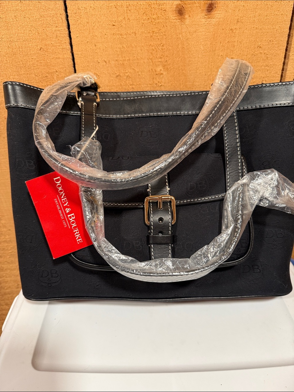 Dooney & Bourke Black Tote with Buckle Front Accent